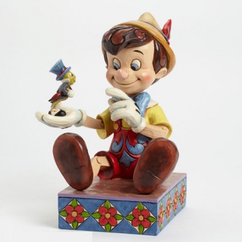 Pinocchio seduto con il grillo parlante