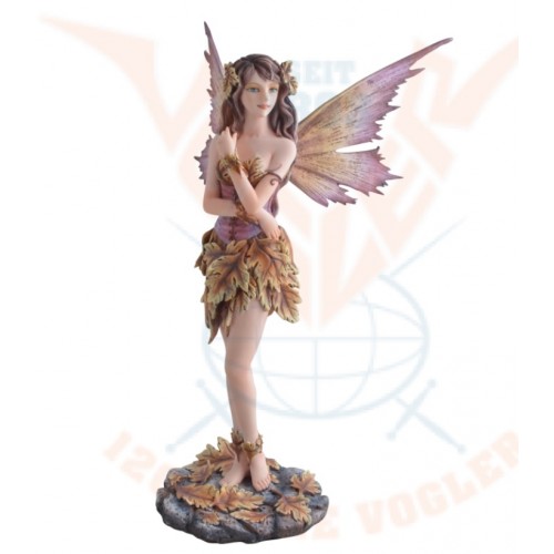 The fairy standing with autumn leaves.