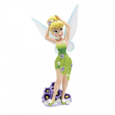 Tinker Bell standing and fixing her hair. Tinker Bell standing and fixing her hair.