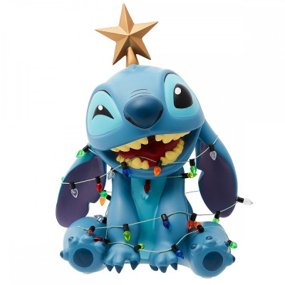 Stitch with Christmas lights and star on his head. Stitch with Christmas lights and star on his head.