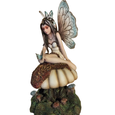 La fatina sul fungo con le farfalle.