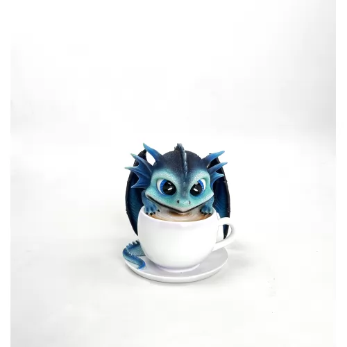 The baby dragon with the white cup.