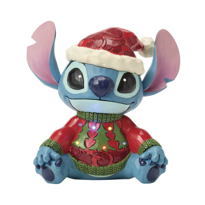 Stitch in einem Pullover und einer Weihnachtsmütze. (von Jim Shore) Stitch in einem Pullover und einer Weihnachtsmütze. (von Jim Shore)